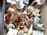 a box full of figurines sitting on a table