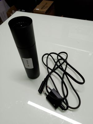 an image of a microphone and a charger on a table