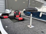 two seats that are on the back of a boat