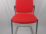 an image of a red office chair against a white backdrop