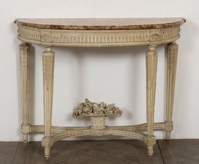 a small table with a vase on top of it