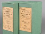 pair of two green boxes with labels on them sitting on a table
