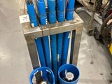 a metal rack with a bunch of tools on top of it