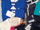 a pile of clothing that is sitting on a table