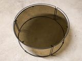 a metal basket with a wire around it