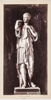 black and white photograph of a statue of a woman holding a bottle