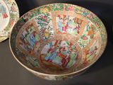 three bowls sitting on a table with different designs on them