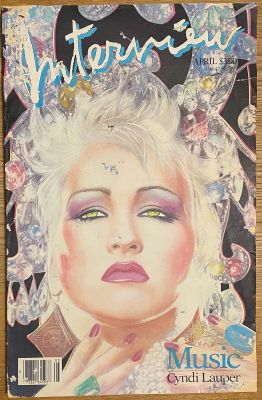 the front cover of a magazine with a picture of a woman with a crown on her head