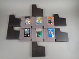 six cartouches de jeux Nintendo disposées en forme de croix