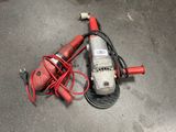 a red machine that is sitting on the ground