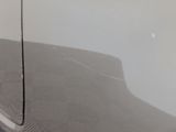 a reflection of a car on the side of the road