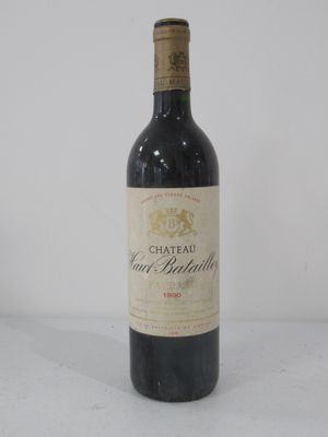 bottle of red wine on a white surface