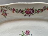 a white plate with a floral design on it