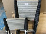 a stack of tools sitting on a pallet next to a box