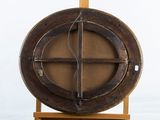 a wooden object with a circular design on top of it
