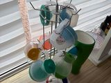 a picture of a rack with cups and spoons on it
