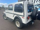 an image of a white jeep parked in a parking lot