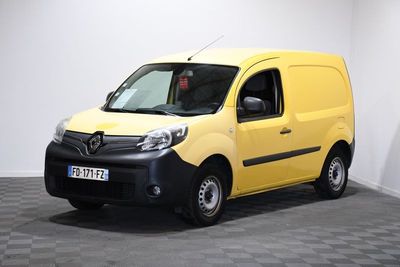 the yellow van is parked in a white room with a checkered floor