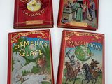 four children ' s books are sitting on a table in front of a white background