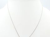 a white necklace with a silver cross on a white mannequin