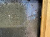 a close up of a window with a glass in it