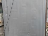 a refrigerator that is sitting in the middle of a room