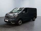 a black van is parked in a room with a white wall