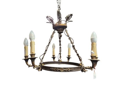 an image of a chandelier with three candles and a bird on it