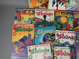 a lot of comic books that are on the table