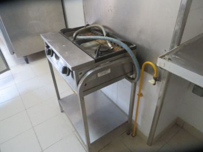 an image of a kitchen with a stove and a sink