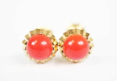 pair of coral and gold stud earrings on a white background