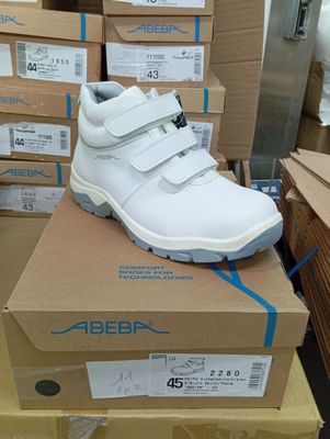 a pair of shoes that are on top of a box