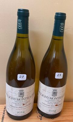 two bottles of wine that are sitting on a table