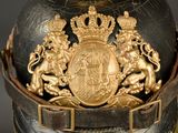a close up of a helmet with a coat of arms on it