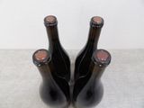two bottles of wine that are sitting on a table