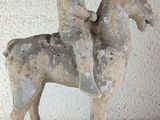 a statue of a man riding a horse on a table