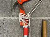 a picture of a red and silver pole with a hammer attached to it