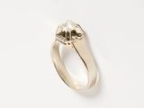 a close up of a ring on a white surface