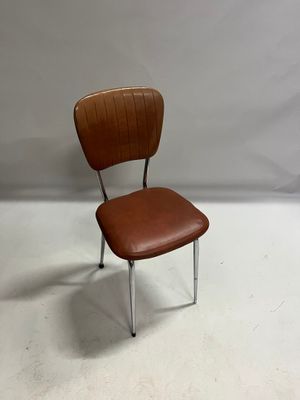 a brown leather chair with chrome legs and a wooden seat