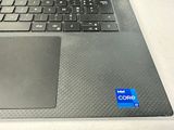 a close up of a laptop keyboard with a mouse on top of it