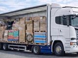 a semi truck with a large load of boxes on the back of it