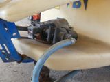 a blue hose attached to the side of a boat