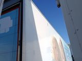 a large white truck with a picture on the side of it