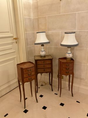 two lamps on the end tables in the corner of the room