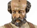 a statue of a man with a beard and a tie