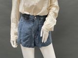 an image of a mannequin mannequin wearing a shirt and denim shorts
