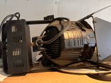 an image of a computer and a fan on a desk