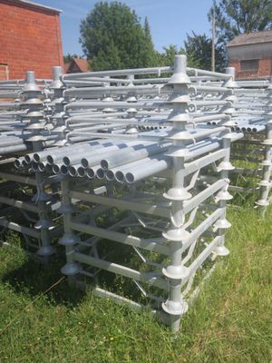 a lot of pipes that are sitting in the grass
