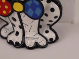 a ceramic figurine of a dalmatian dog wearing sunglasses