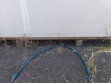 a hose attached to the side of a white truck